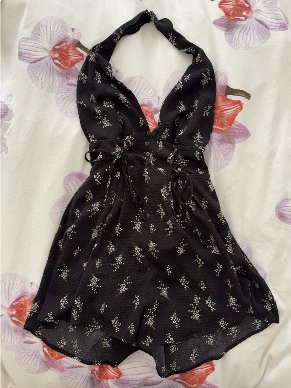 Lush black romper with floral print